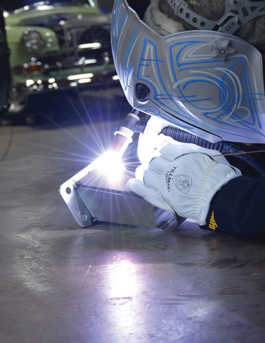 welding with white tillman gloves on white background