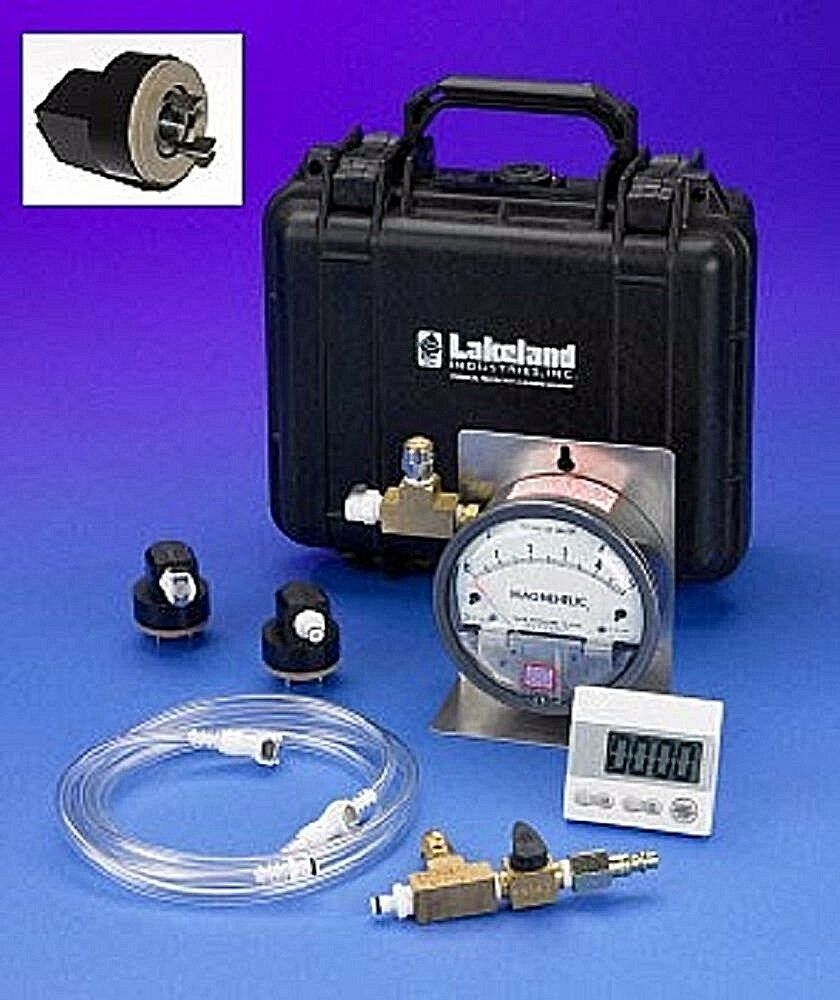 Various parts of Lakeland 00011 Pressure Test Kit against blue background