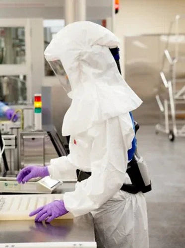 Person wearing 3M PAPR in a lab setting
